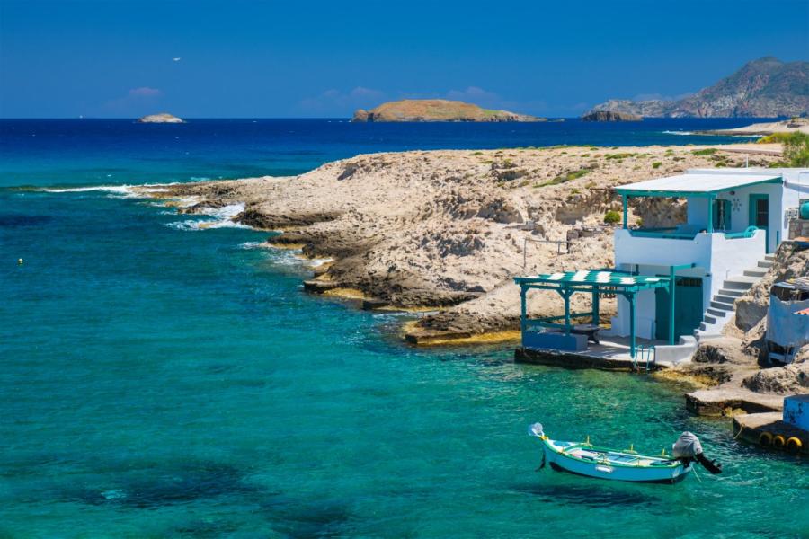 A couple exploring the colorful landscapes of Milos