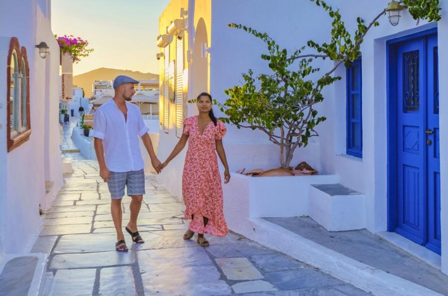 A couple walking in the narrow streets of Mykonos